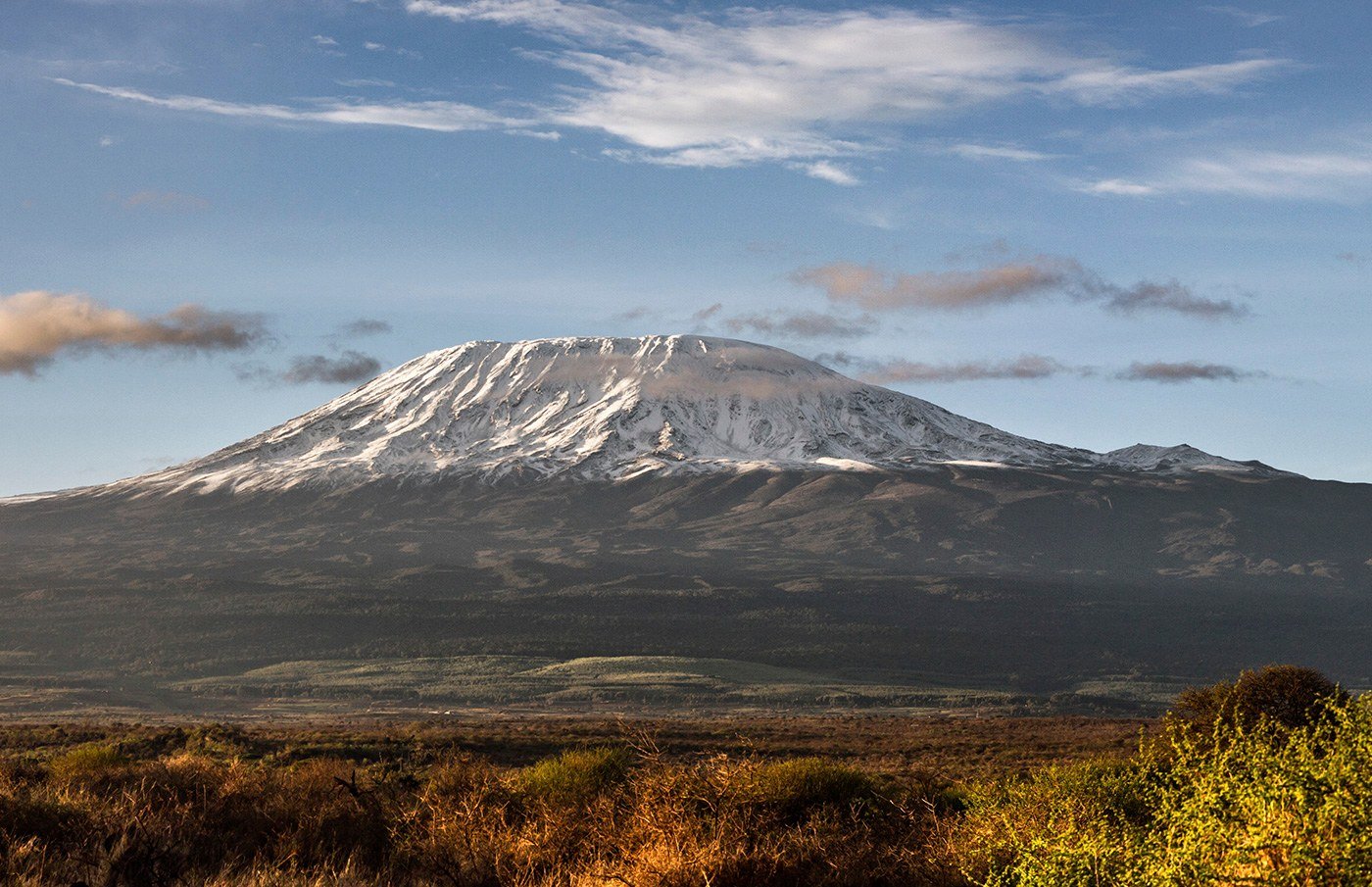 Snow-capped Kilimanjaro rising above the plains as seen from Elerai Camp, Amboseli.