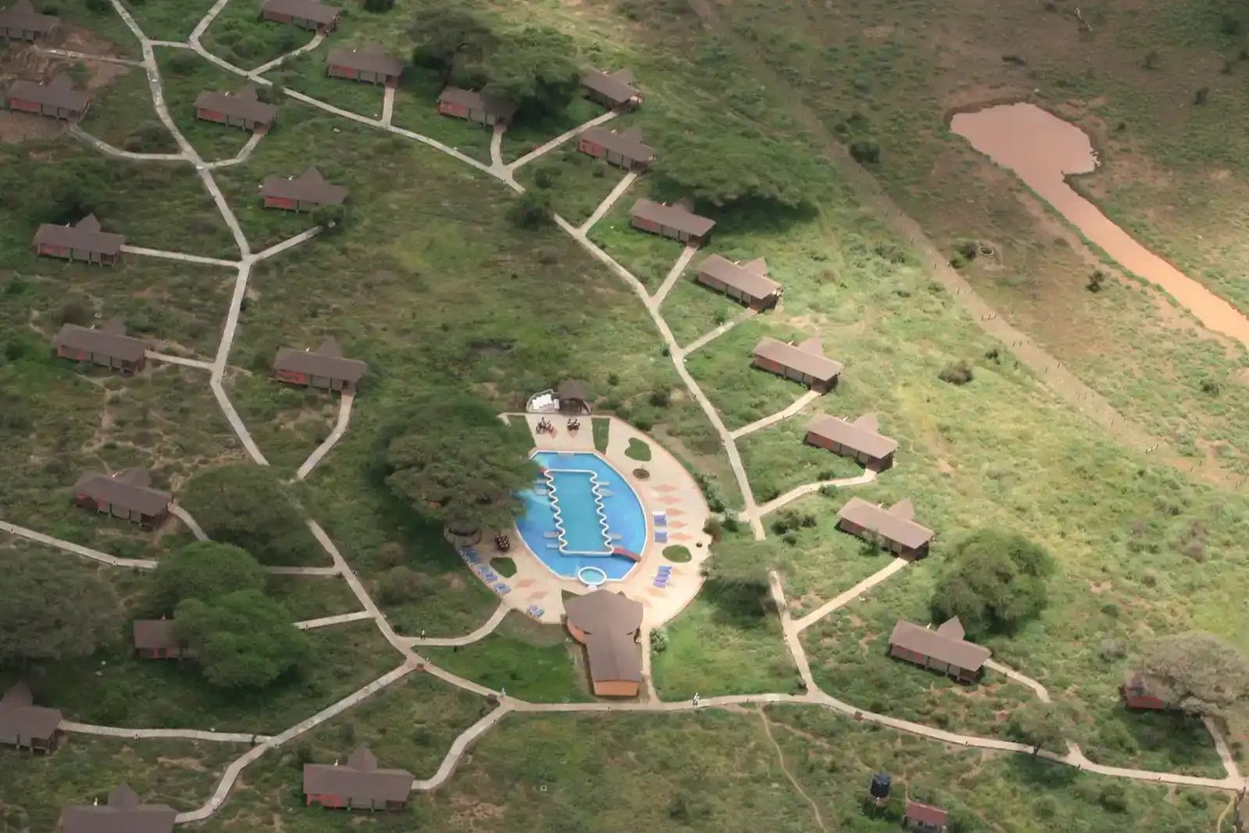Aerial view of the camp's circular layout with pool and pathways at Kilima Safari Camp.