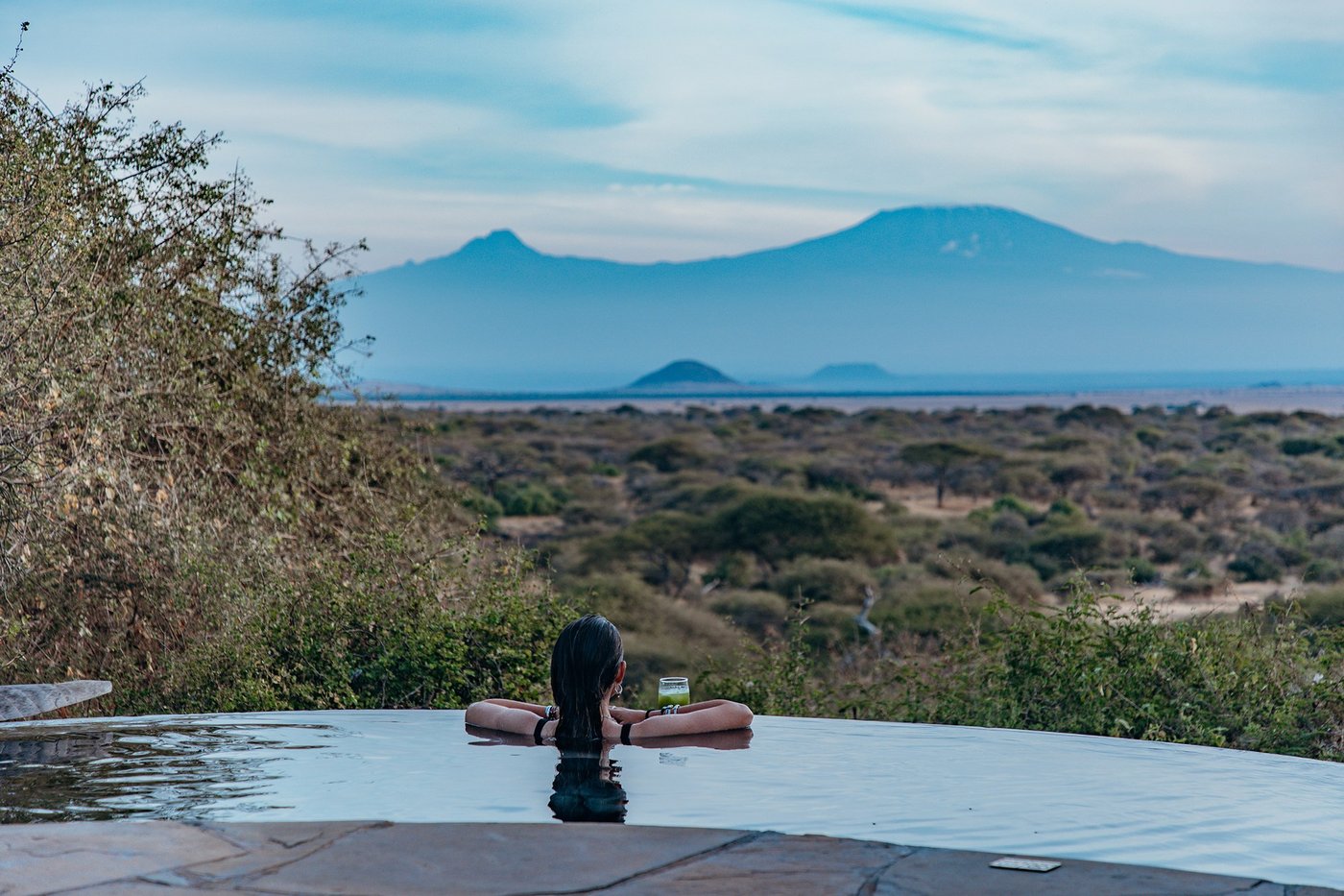 Infinity pool edge overlooking the plains toward distant hills at ol Donyo Lodge.